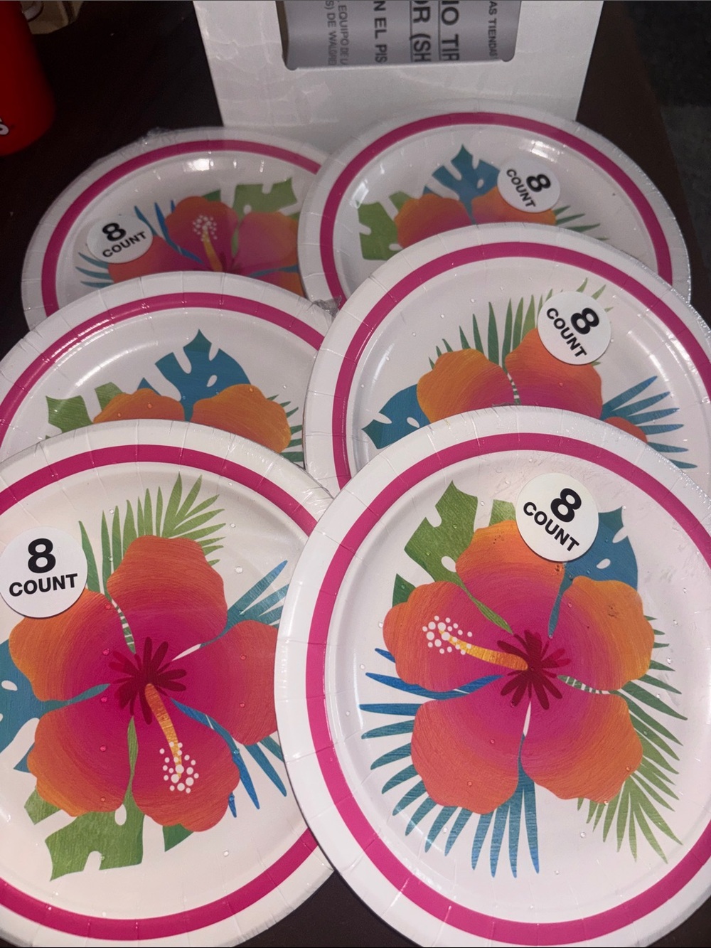 6 pack of 8 count of flower paper plates and 2 packs of napkins